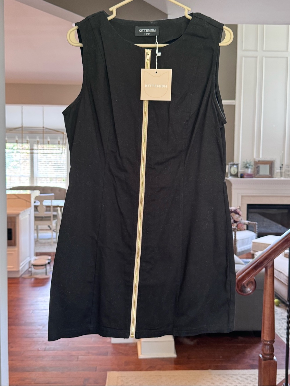Kittenish Black Sleeveless Mini Dress with Gold Front Zip